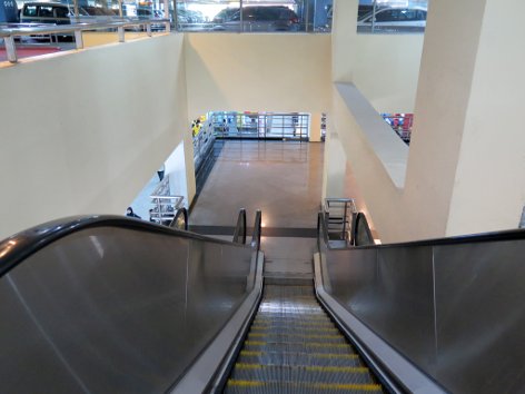 Use the escalator to go down to Level 1