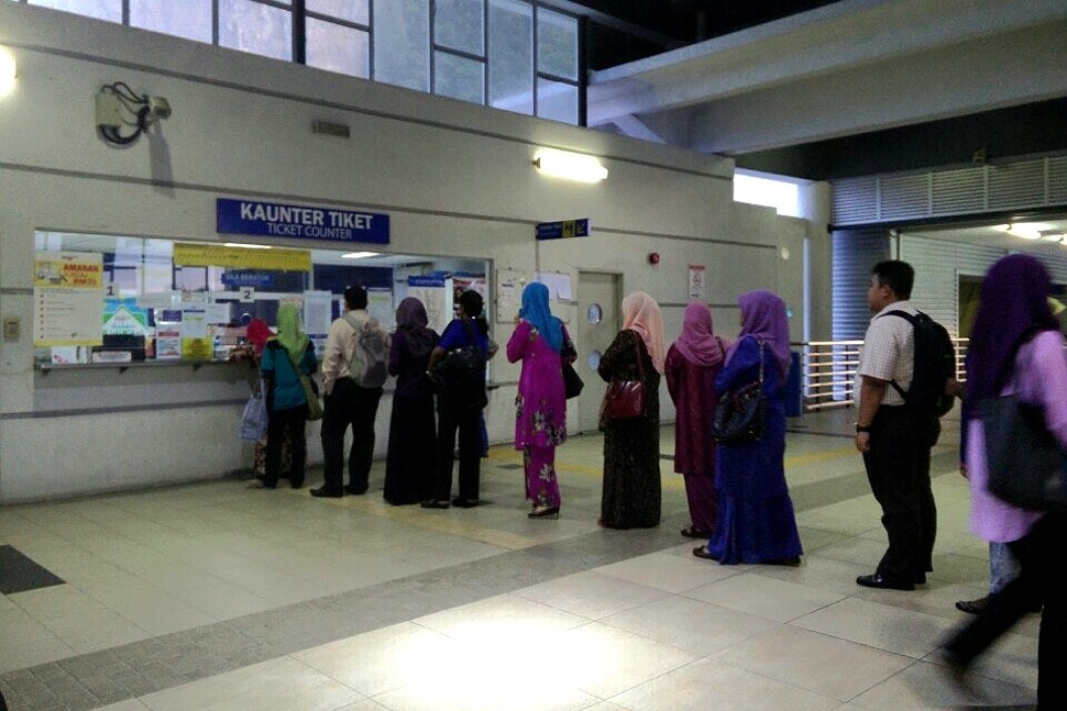 Commuters lining up for ticket purchase
