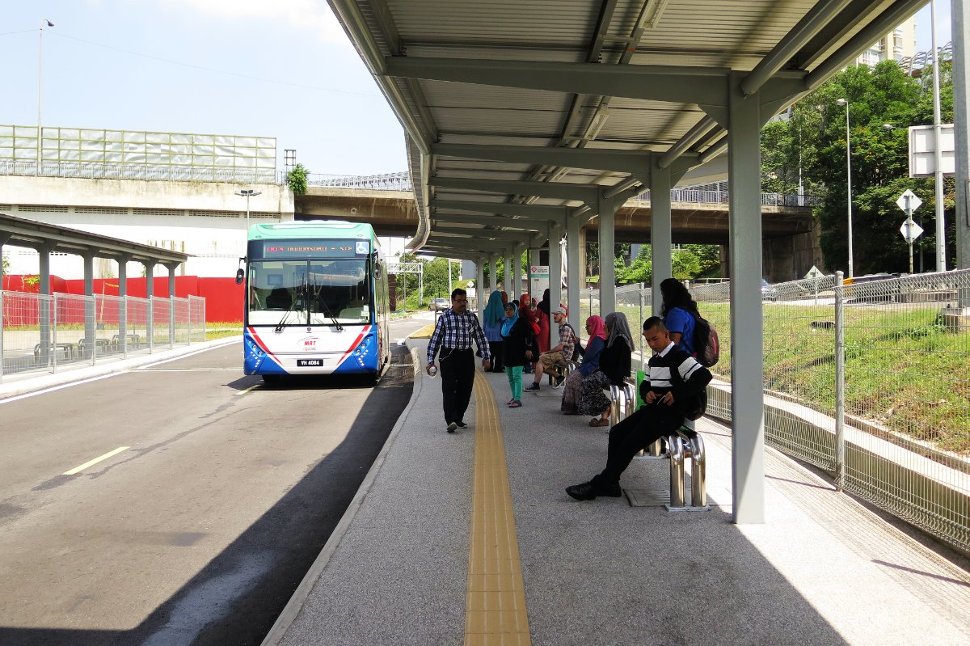Commuters waiting for bus at the feeder bus hub