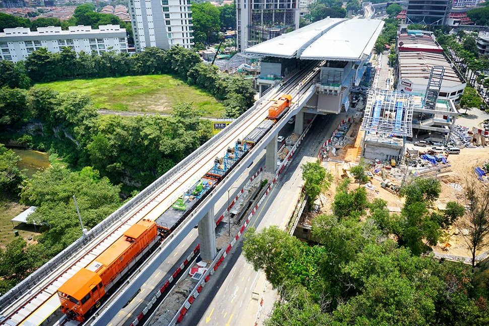 Locomotives transporting equipment on the completed guideway heading towards the Taman Tun Dr Ismail Station. (Apr 2016)