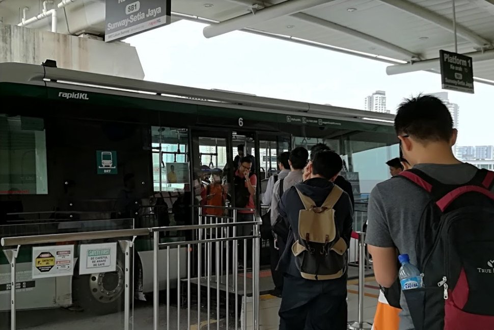 Passengers boarding the BRT bus at this integrated LRT / BRT station