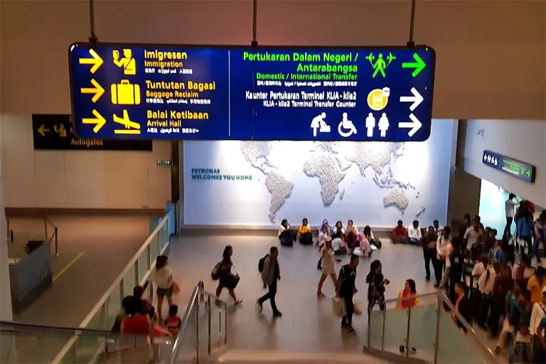 Arrival Hall in sight, observe the signboards for directions