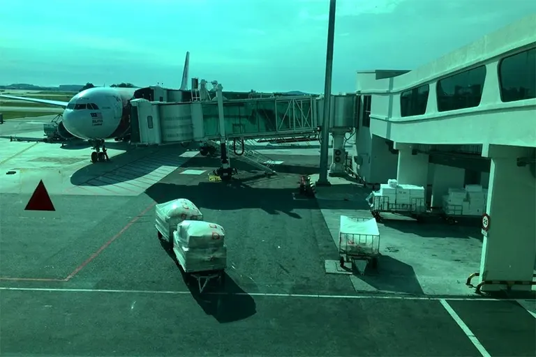 View of AirAsia flight connected to Aerobridge from the Pier