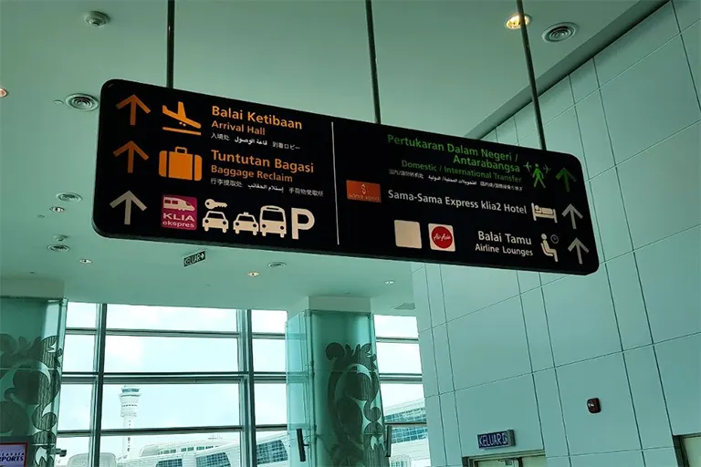 Observe the overhead signboard for directions to International Transfer counter