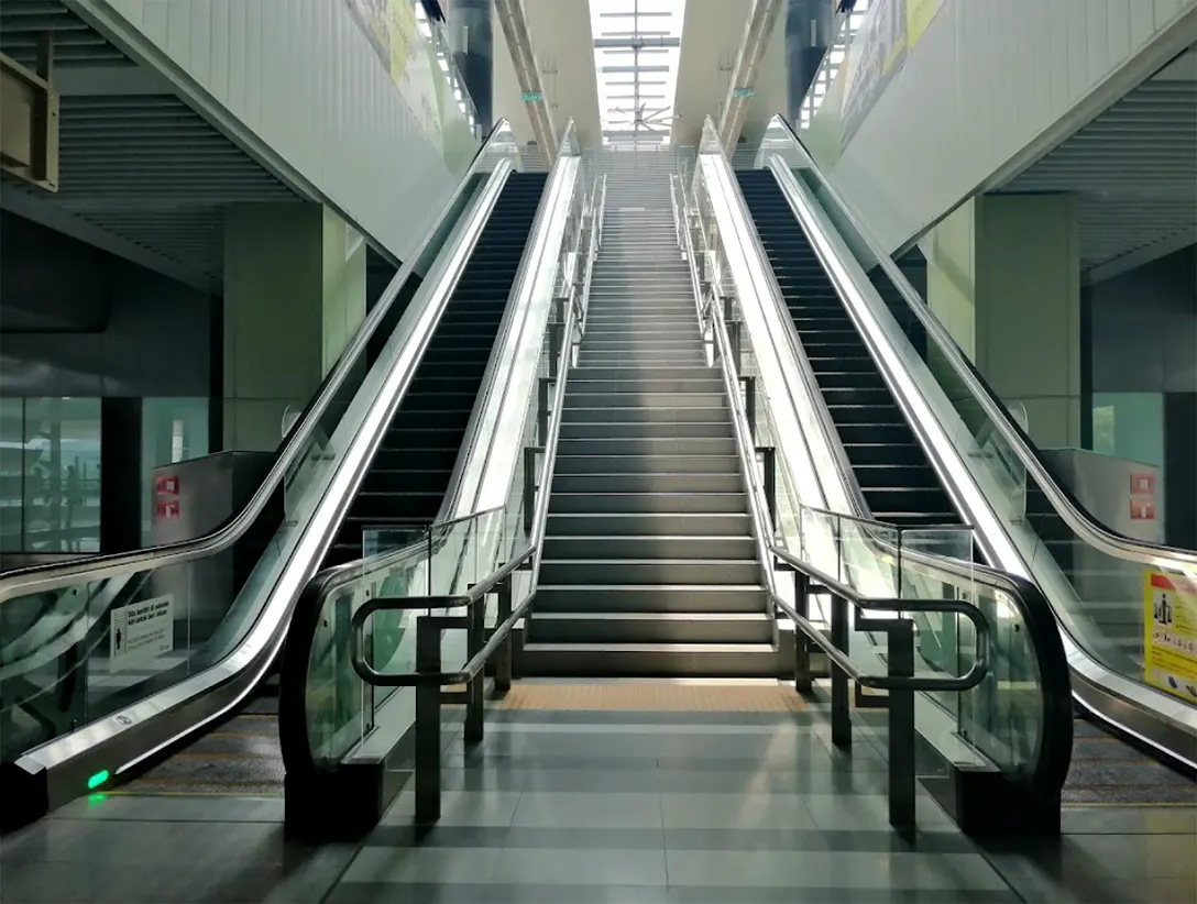 Escalators and staircase for movement between the Concourse level and the Boarding platforms